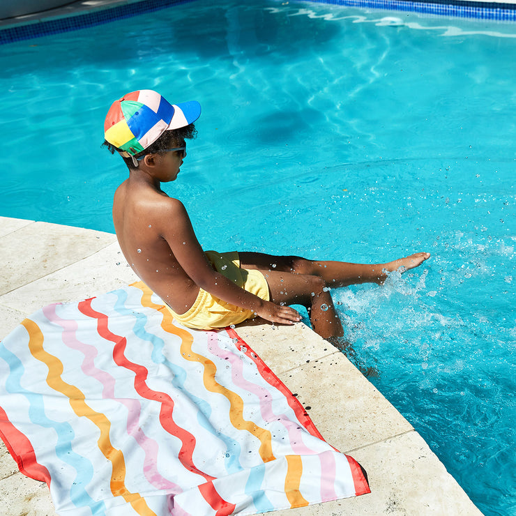 Beach towel that online folds into a bag